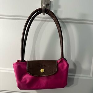 Lightly used bright pink Longchamp Le Pliage shoulder bag.